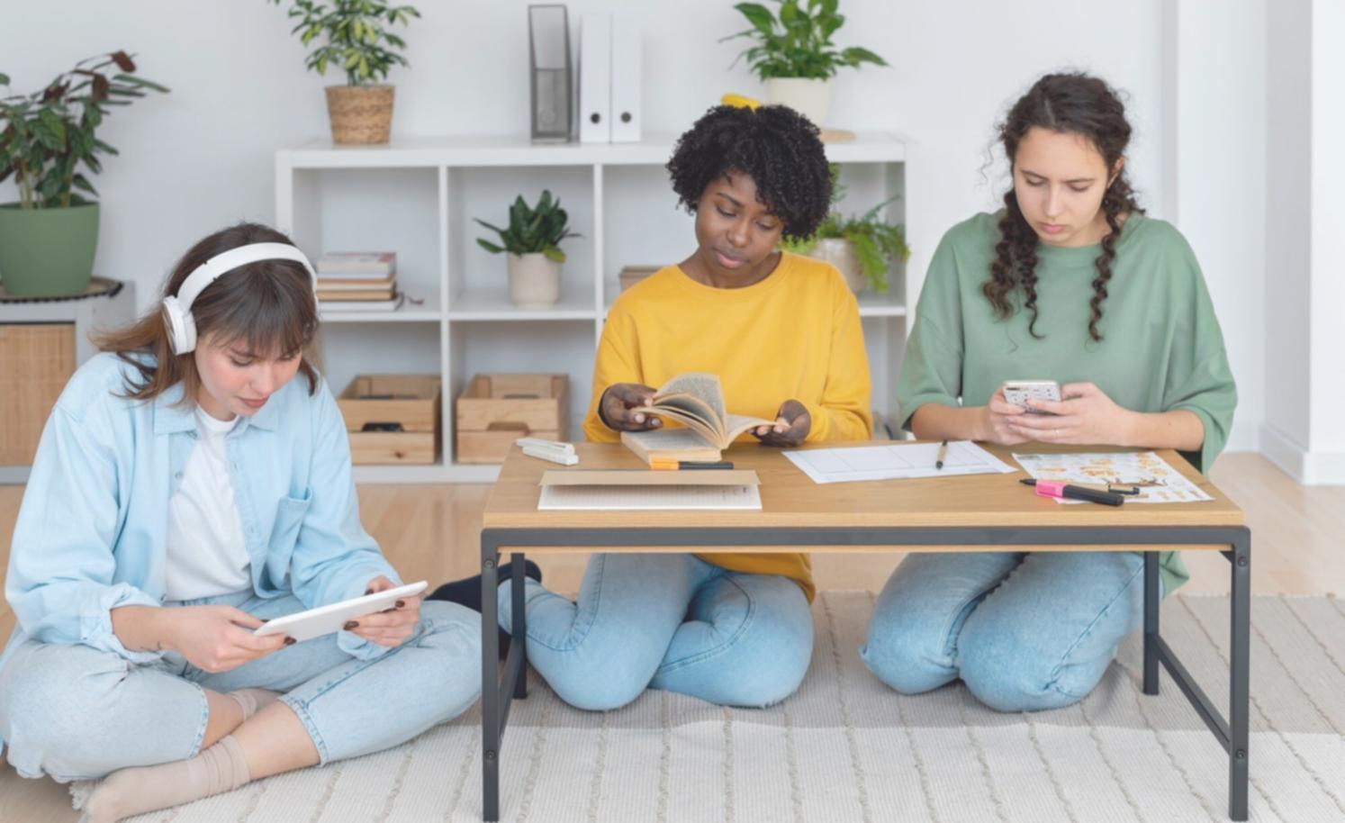 Students collaborating on financial planning exercises in modern learning environment